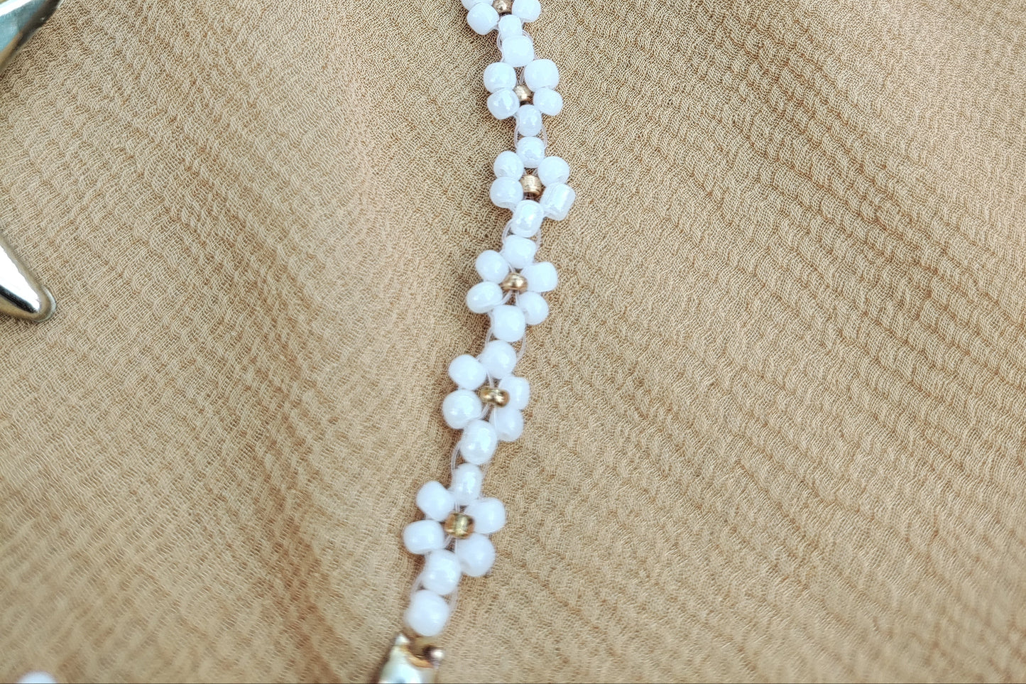 Gold in white beads floral design