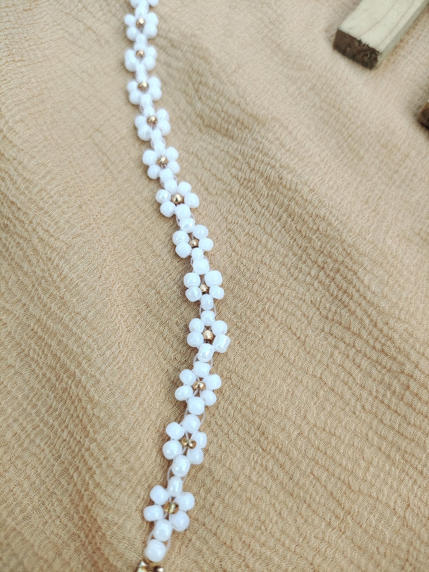 Gold in white beads floral design