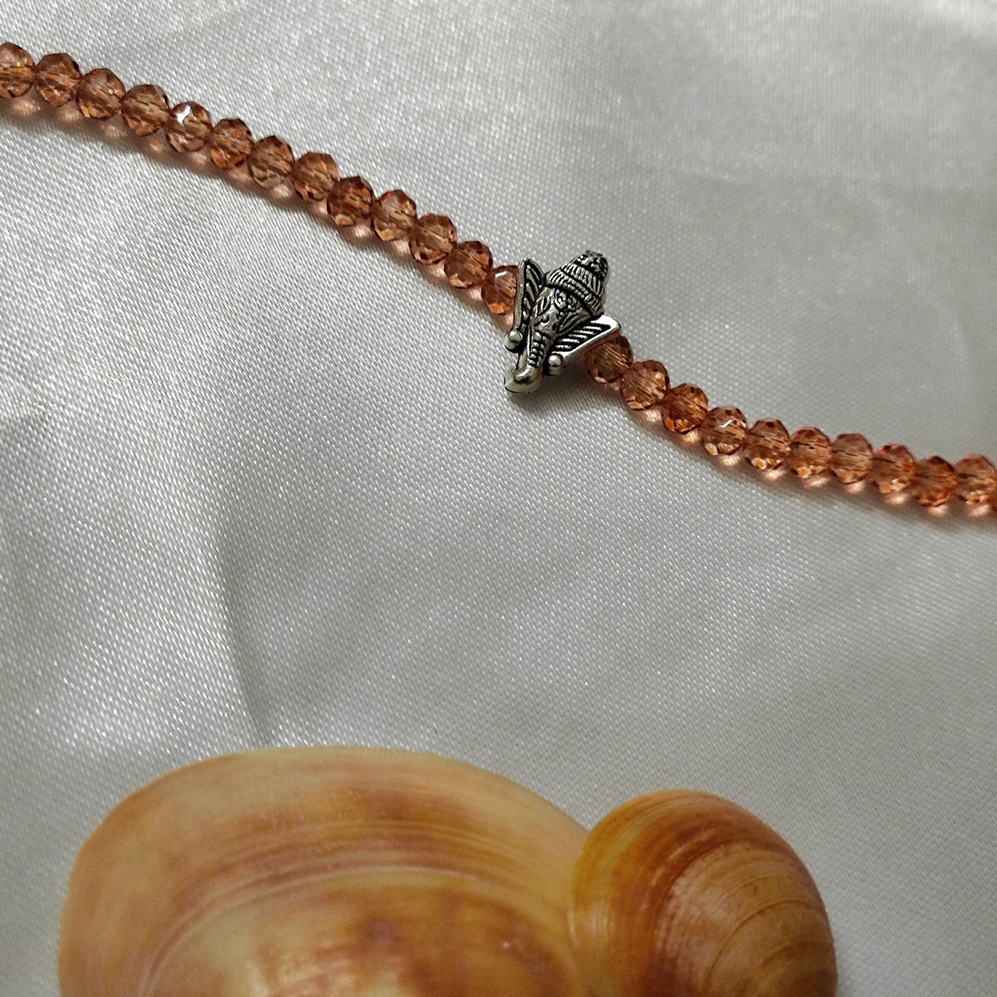 Orange bead with Ganesh pendant