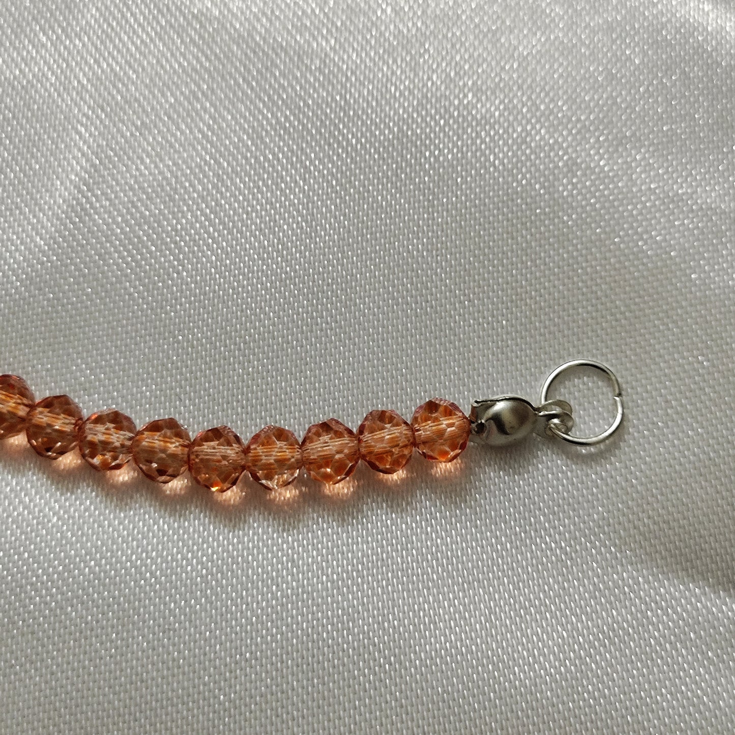 Orange bead with Ganesh pendant